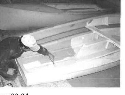 A volunteer working on the cockpit interior of an Albacore hull