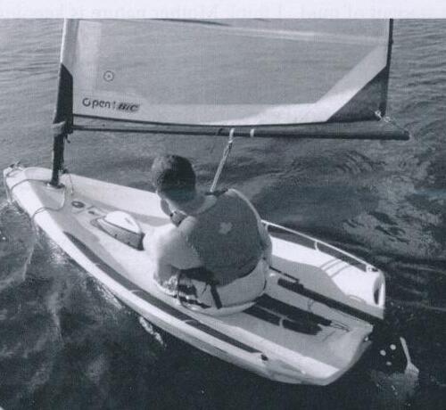 An overhead view of a sailor racing a small Open Bic dinghy