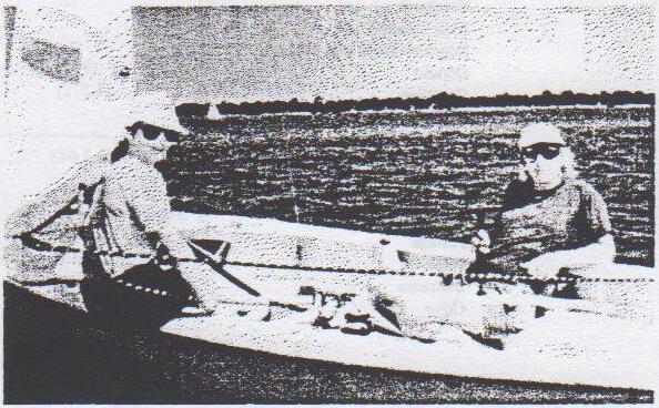 Julia Erichsen and Jorg Pawlik sitting in their Albacore on the water