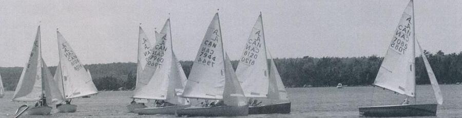 A lineup of colourful, newly reconditioned Shelburne Albacores under sail