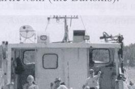 The race committee boat, with several people aboard