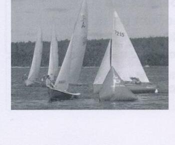 Albacores racing, sail number 7215 in the foreground