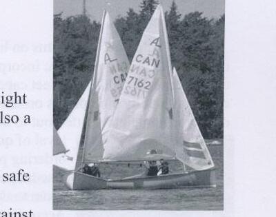 An Albacore, sail number CAN 7162, sailing with two crew aboard