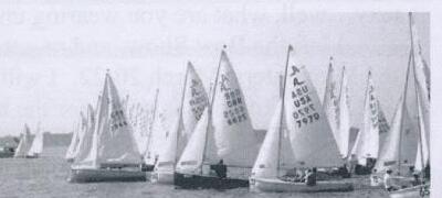 A fleet of Albacores racing under sail
