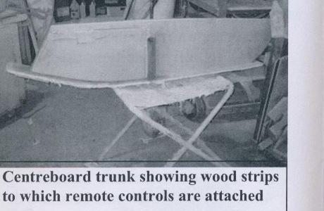 Centreboard trunk showing wood strips to which remote controls are attached