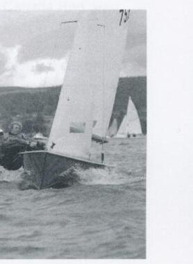 Judy Armstrong planing an Albacore hard with other boats visible behind