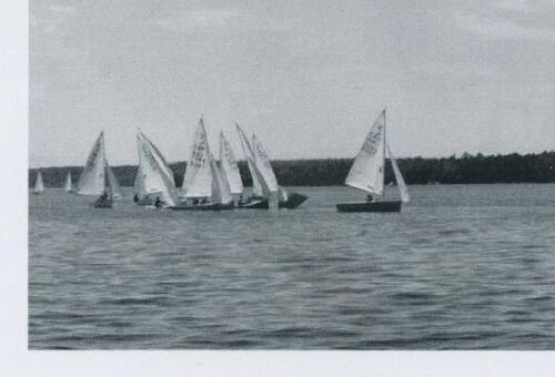 A fleet of Albacores racing, one boat well ahead of the pack