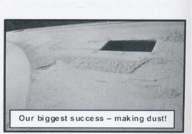 A close-up of an Albacore hull covered in sanding dust and dimples, with a caption reading Our biggest success – making dust
