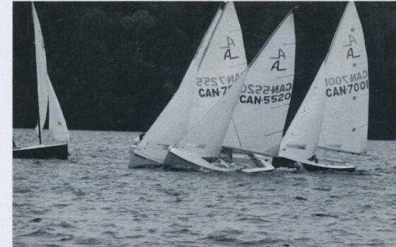 A tight pack of Albacores racing on Mary Lake, numbered CAN-7255, CAN-5520, and CAN-7001