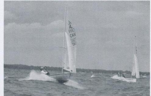 Two Albacores running downwind in waves, one surfing ahead of the other