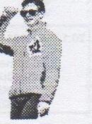 Andrew in a CAA jacket, shading his eyes with one hand