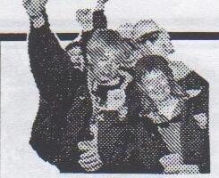 A group of sailors cheering with raised arms