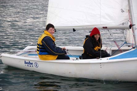 Richard Evans and Rachel Harris sailing an Albacore named Babe on the water