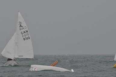 An Albacore heeled hard in heavy air, bow burying