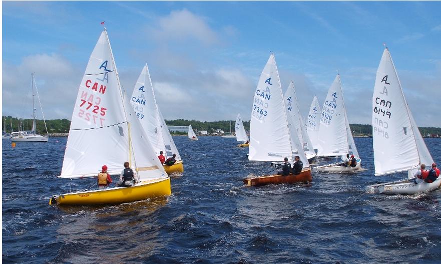 A yellow-hulled Albacore leads a tight fleet start on Shelburne Harbour