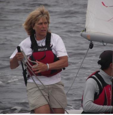 Mary Neumann helming an Albacore