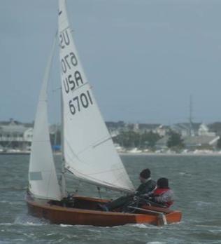 Wood-hulled Albacore 6701 with the top of the jib luffing from excessive twist