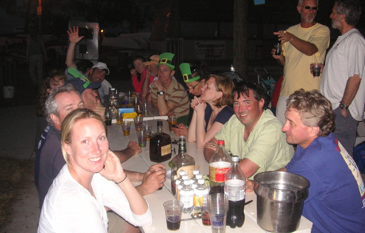 A group dinner at Sarasota Sailing Squadron, sailors in green leprechaun hats