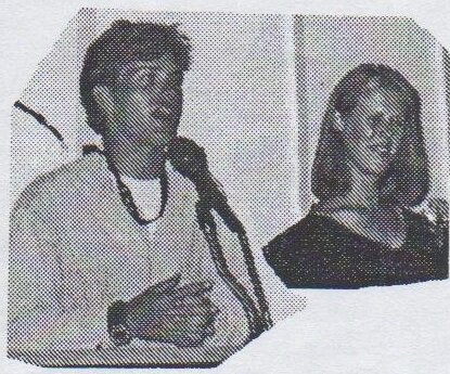 Niall Martin speaking at a microphone, with crew Amanda Oates beside him