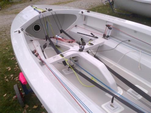 Interior of a new white Ovington-built Albacore hull, unfitted, on a trailer
