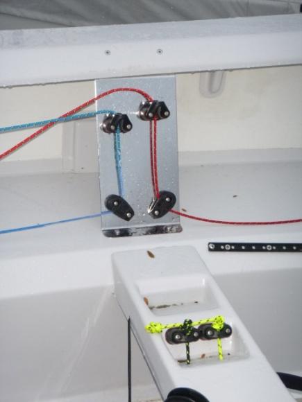 Close-up of a Rondar stainless side control panel with blue and red control lines rigged through blocks