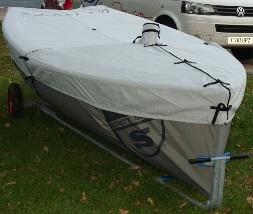 A fitted grey boat cover on an Albacore trailer