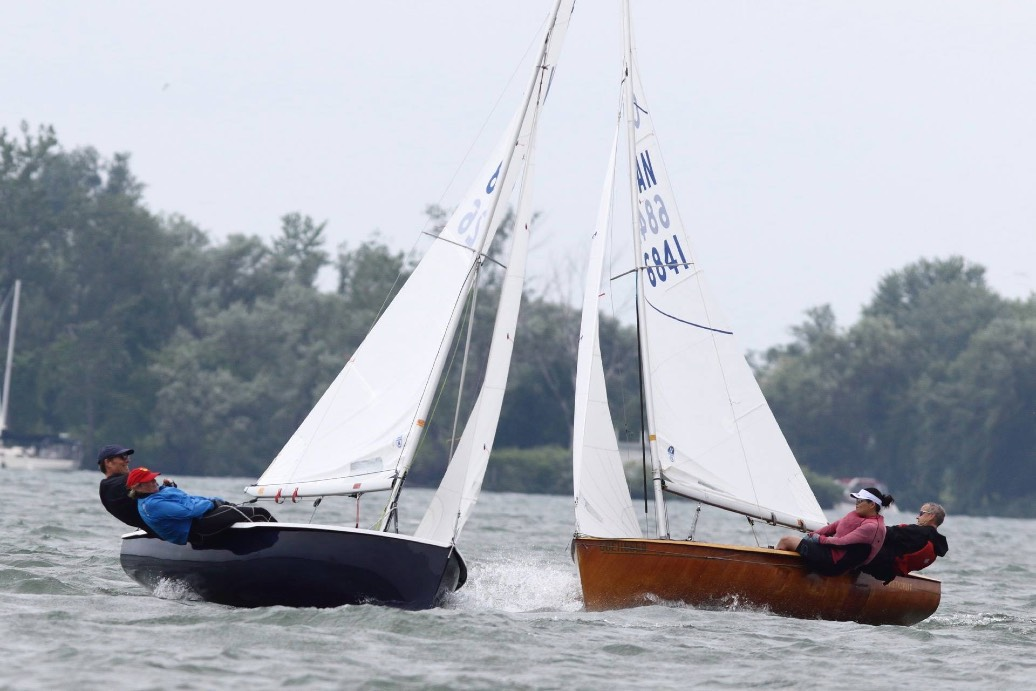 A black hull and a wooden Albacore racing close together