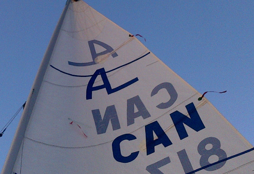 Close-up of an Albacore mainsail with three telltales circled