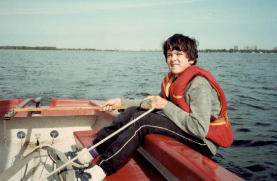Little sister Laura on the tiller and Rory on the mainsheet, circa 1985