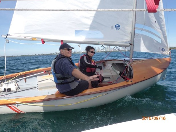 Two sailors communicating on the water