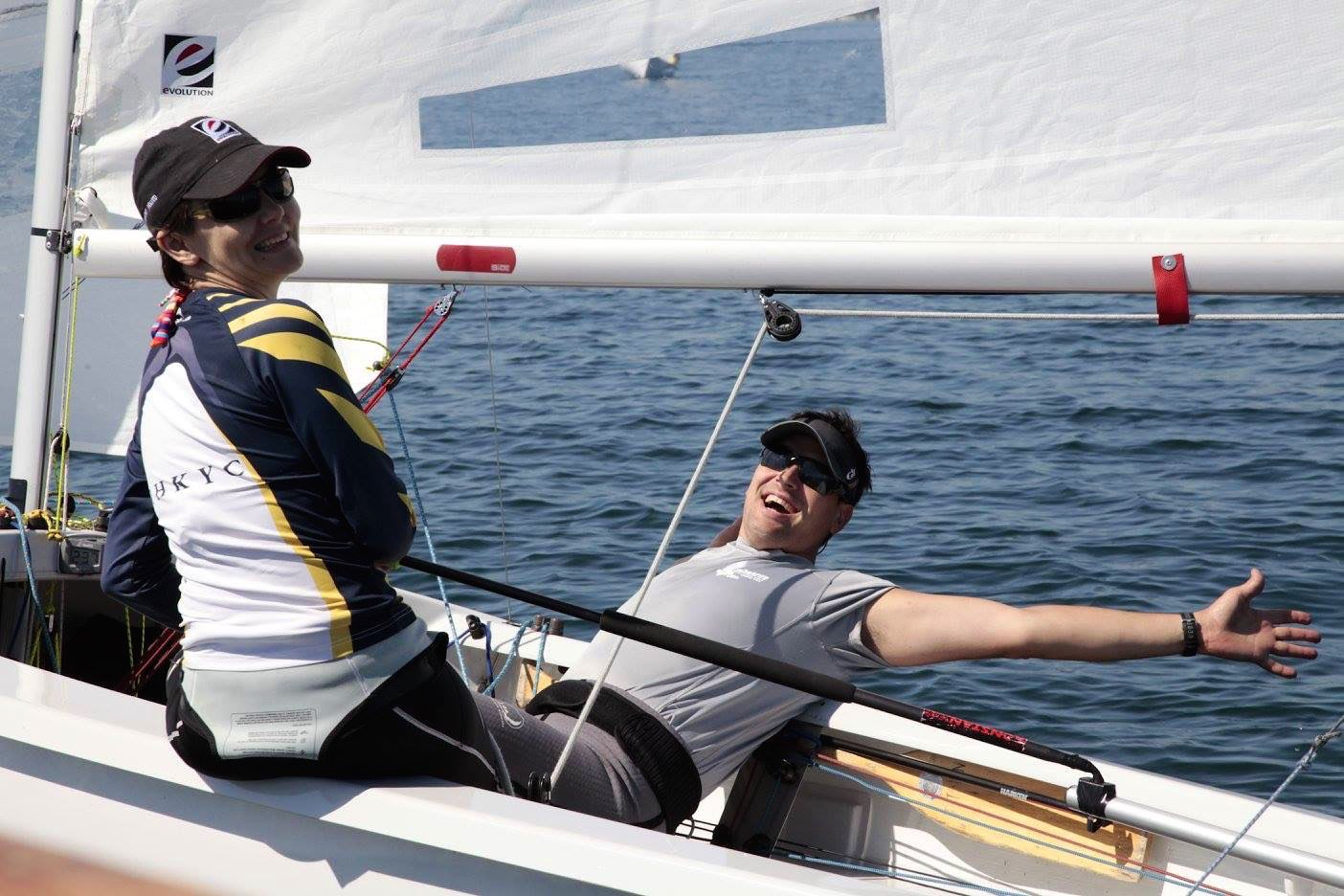 A crew laughing on a red Albacore, arm outstretched, Canadians Day 1