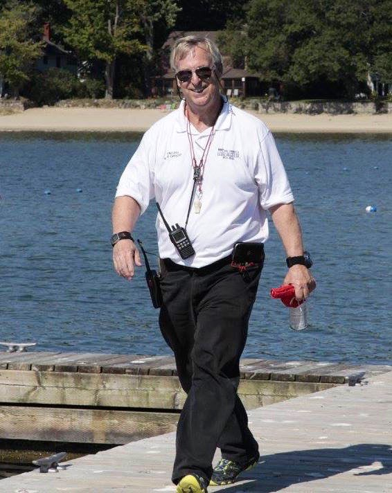 David Sprague, PRO, walking the dock with a radio