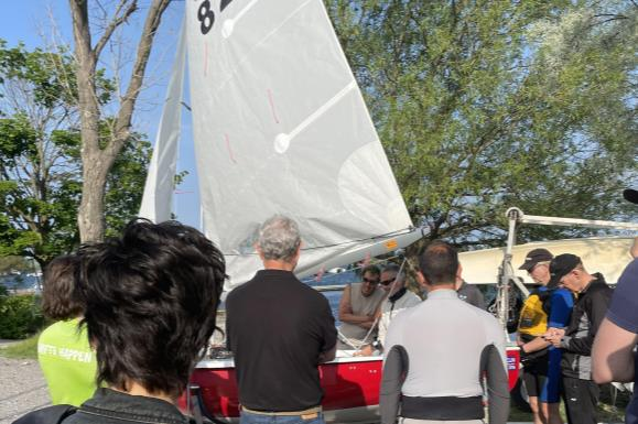 Volunteers rigging a boat before a race