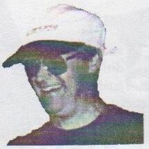 Bob Stiff, smiling, in a white cap and sunglasses