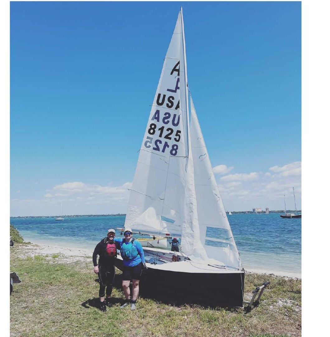 Michael Heinsdorf and crew Lizzie Ellis on the beach with their boat