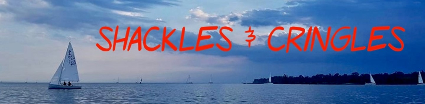Shackles & Cringles banner over a sunset sail