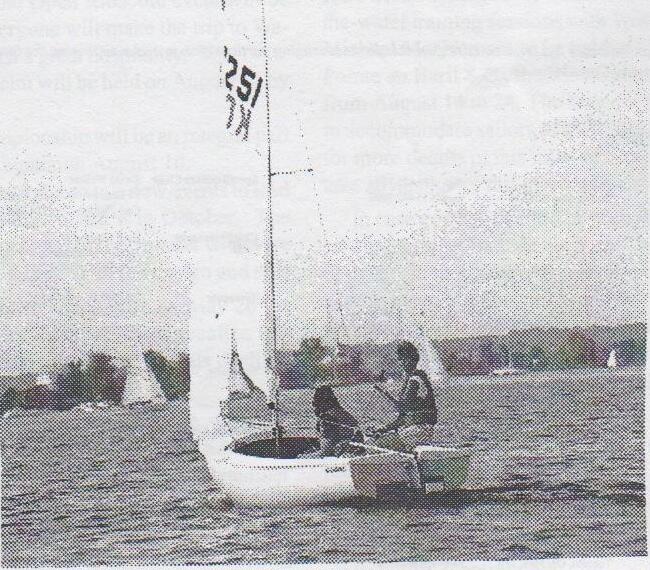 Cover photo: an Albacore, sail number 251, sailing upwind with two crew hiking, other boats in the background