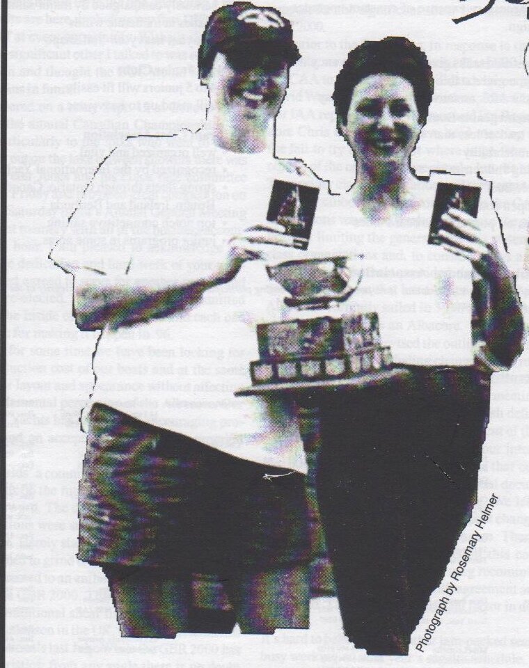 Evelyn Simpson and Dorota Konopacka smiling and holding up trophies at the Canadian Championships