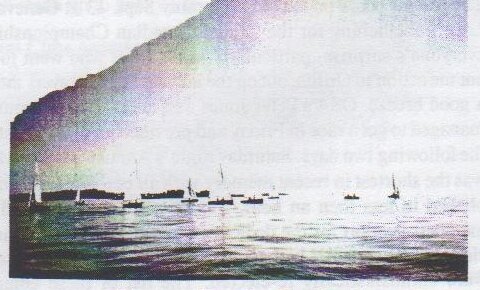 Faded colour photo of a fleet of dinghies sailing on Humber Bay under a dark sky