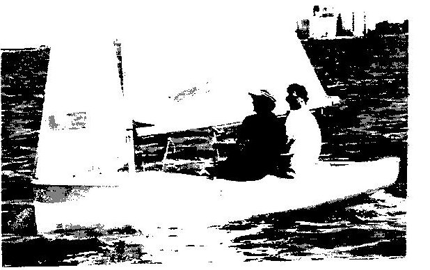 Chris Gorton and John Struthers sailing an Albacore past an anchored ship
