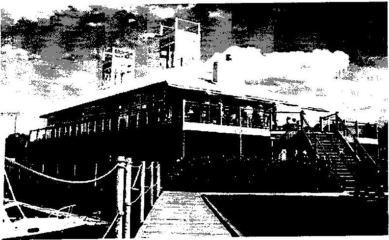 The Nepean Sailing Club clubhouse seen from its docks under a cloudy sky