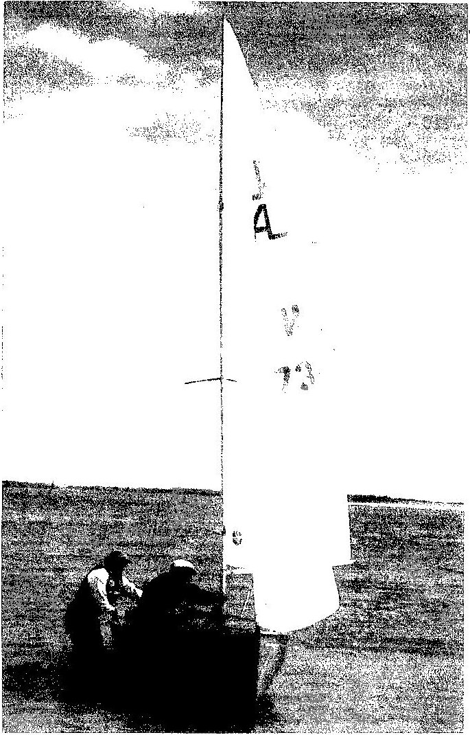 Rosemary Helmer and Peter Davis launching an Albacore from the beach at the 1997 World Championships