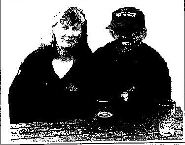 Rosemary Helmer and Pete Davis seated at a table