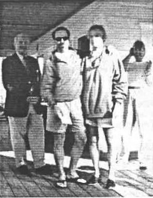 Raines Koby and Abby MacInnes standing with friends on a club veranda