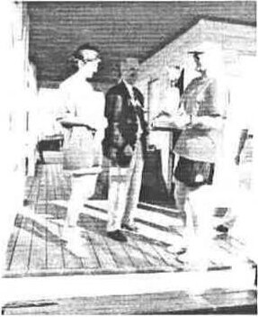 Mike Morrison and Fran Steacy receiving the Masters trophy on the club veranda