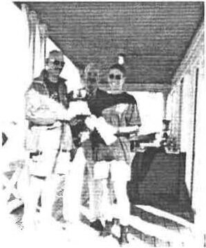 Howie Glen and Anne-Marie Carey receiving their prize on the club veranda