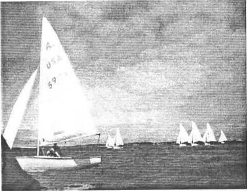 An Albacore with US sail number 5923 sailing out to the race course, other Albacores on the horizon