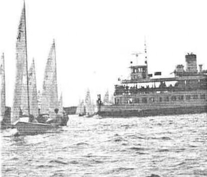 Albacores sailing in Toronto's Inner Harbour beside a large passenger ferry