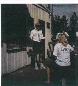 Two sailors on the dock outside the OHCC clubhouse