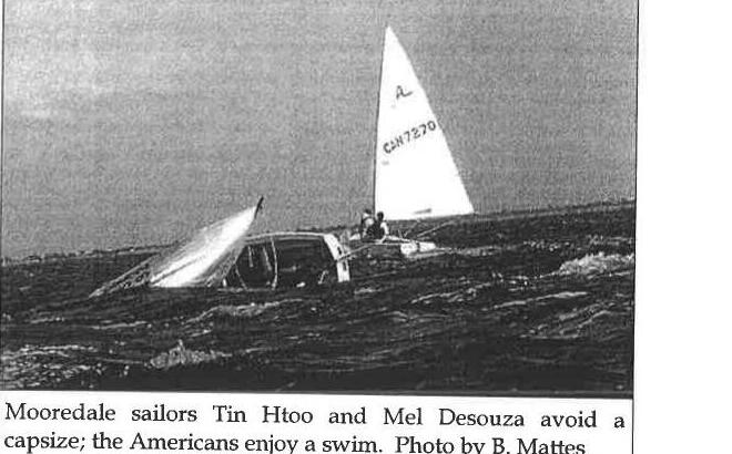 Mooredale sailors Tin Htoo and Mel Desouza avoid a capsize; the Americans enjoy a swim. Photo by B. Mattes